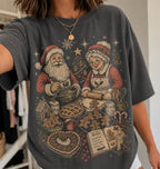 Pepper Christmas baking shirt featuring Santa and Mrs Claus making gingerbread cookies and pies with festive kitchen supplies