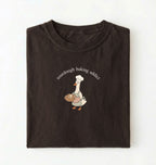 Flat lay of a dark chocolate Sourdough Baking Addict shirt with baker goose holding artisan bread for sourdough enthusiasts on a white background 