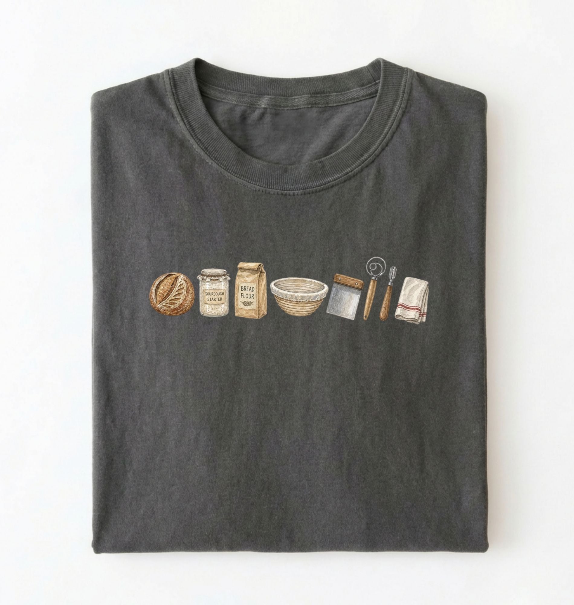Flat lay of a charcoal sourdough baking essentials shirt with starter flour dough bowl and bread making tools on a white background 