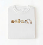 Flat lay of a white sourdough baking essentials shirt with starter flour dough bowl and bread making tools on a white background 
