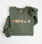 Flat lay of a green sourdough baking essentials sweatshirt with bread starter flour bowl and baking tools on a white background 