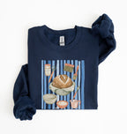Flat lay of a navy blue Sourdough baking tools sweatshirt featuring artisan bread, starter jar, banneton, and baking supplies on a white background 