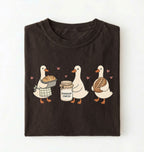 Flat lay of a Cute sourdough ducks graphic shirt featuring bread and sourdough starter design for bakers on a white background