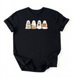 Flat lay of a white sourdough shirt featuring four cute baking ghosts with a starter jar, mixing bowl, bench scraper and bread loaf on a white background 