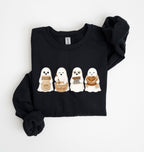 Flat lay of a black sourdough sweatshirt featuring four cute baking ghosts with a starter jar, mixing bowl, bench scraper and bread loaf on a white background 