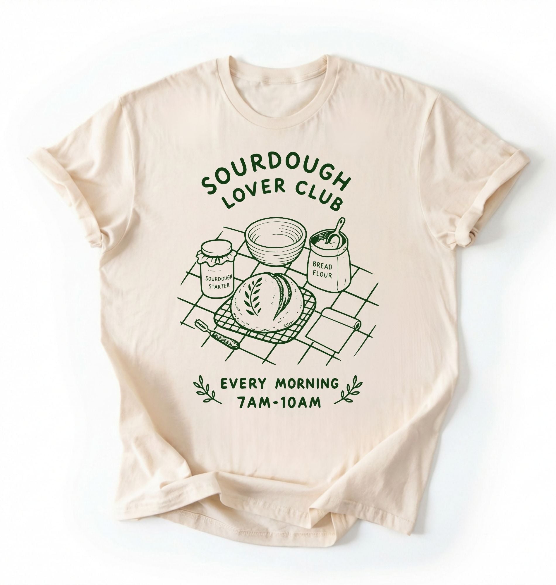 Flat lay of a ivory Sourdough Lover Club graphic shirt with artisan bread baking design for sourdough enthusiasts on a white background 