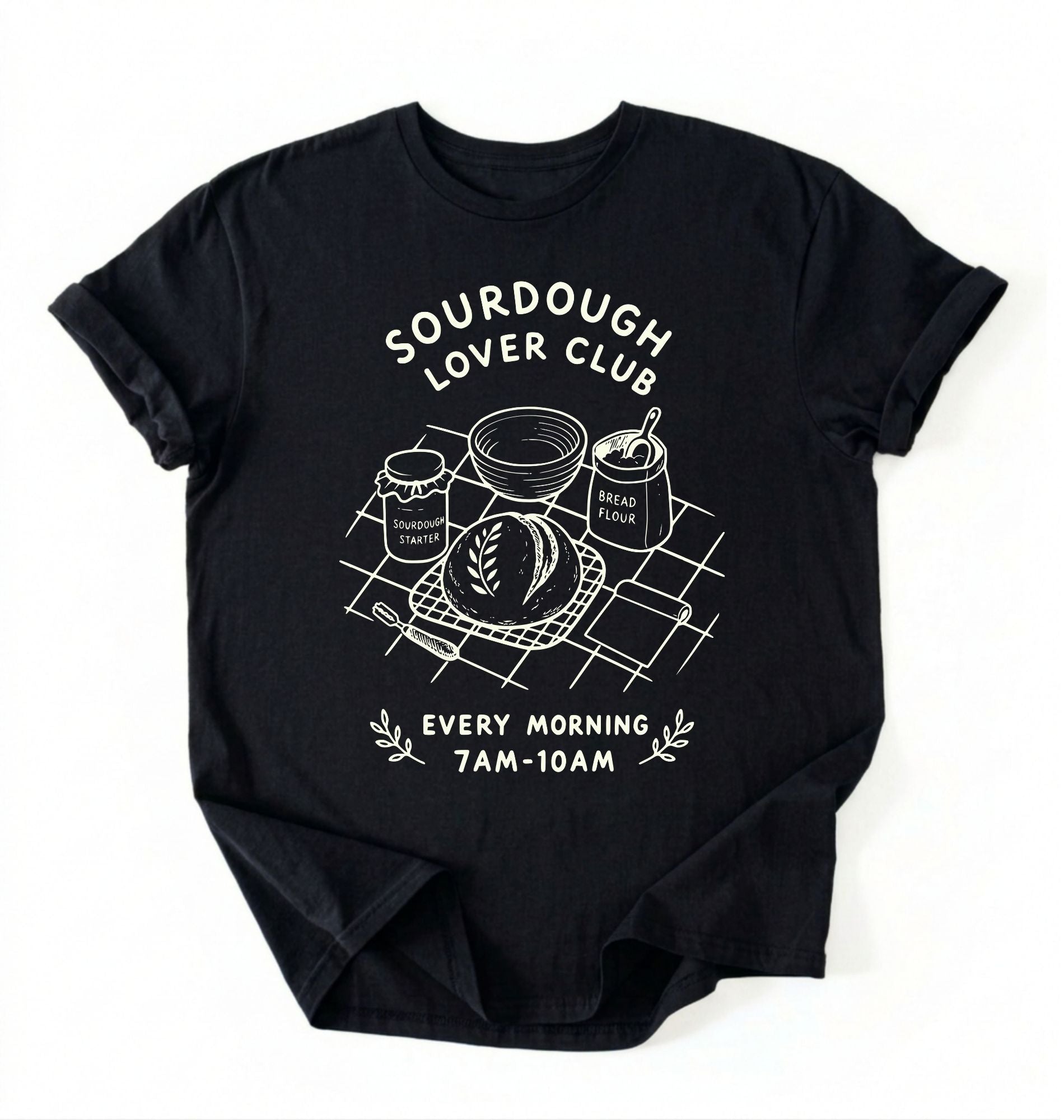 Flat lay of a black Sourdough Lover Club graphic shirt with artisan bread baking design for sourdough enthusiasts on a white background 