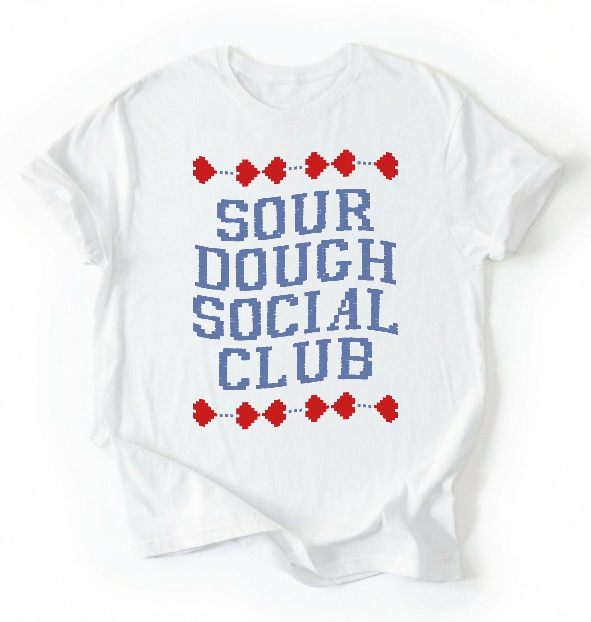 Flat lay of a white sourdough social club shirt cream funny baking t shirt bread lover gift cottagecore aesthetic on a white background 