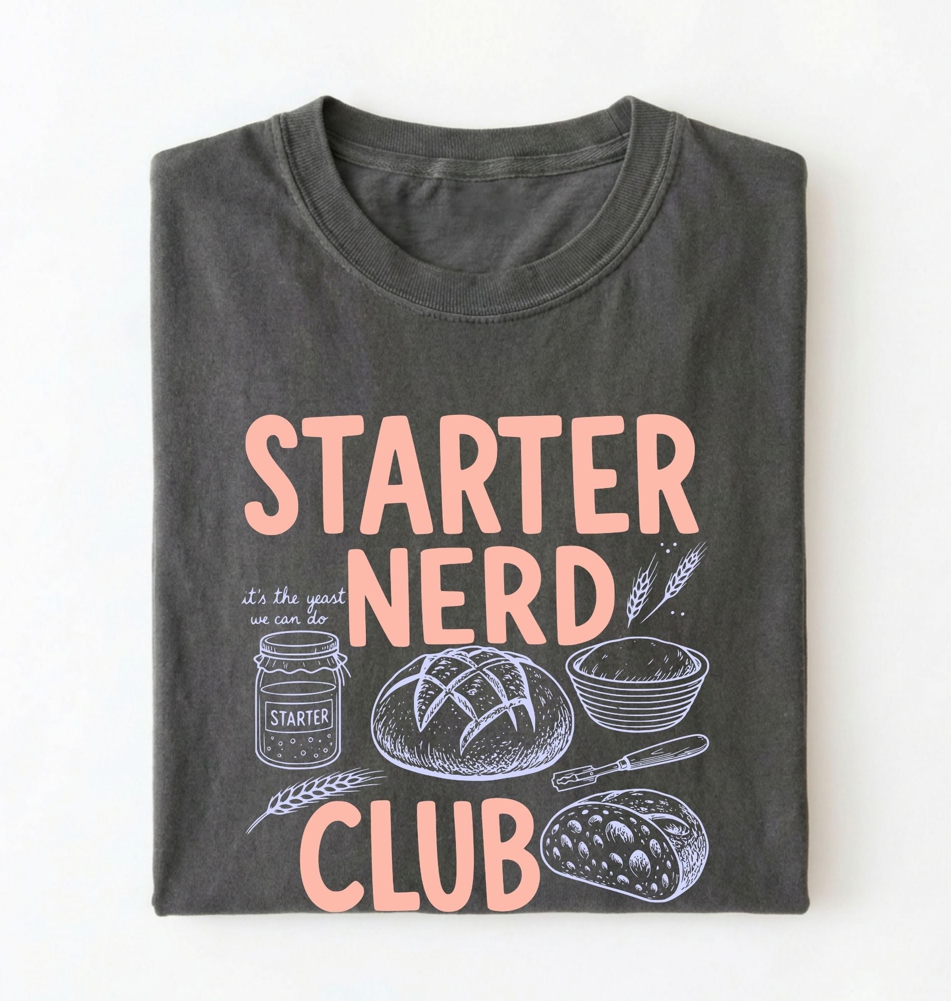 Flat lay of a pepper starter nerd club shirt with sourdough starter jar bread and baking illustrations funny baker gift on a white background 