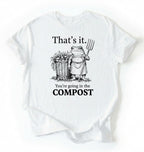 Flat lay of a White t-shirt featuring an illustrated frog with text reading “That’s it you’re going in the compost frog t-shirt” on a white background