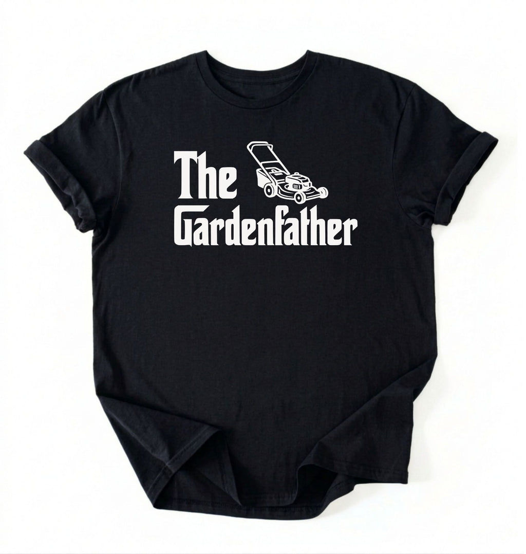 Flat lay of a the gardenfather shirt black funny gardening dad t shirt plant lover gift on a white background 