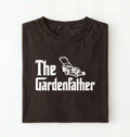 Flat lay of a the gardenfather shirt brown funny gardening dad t shirt plant lover gift on a pepper background 