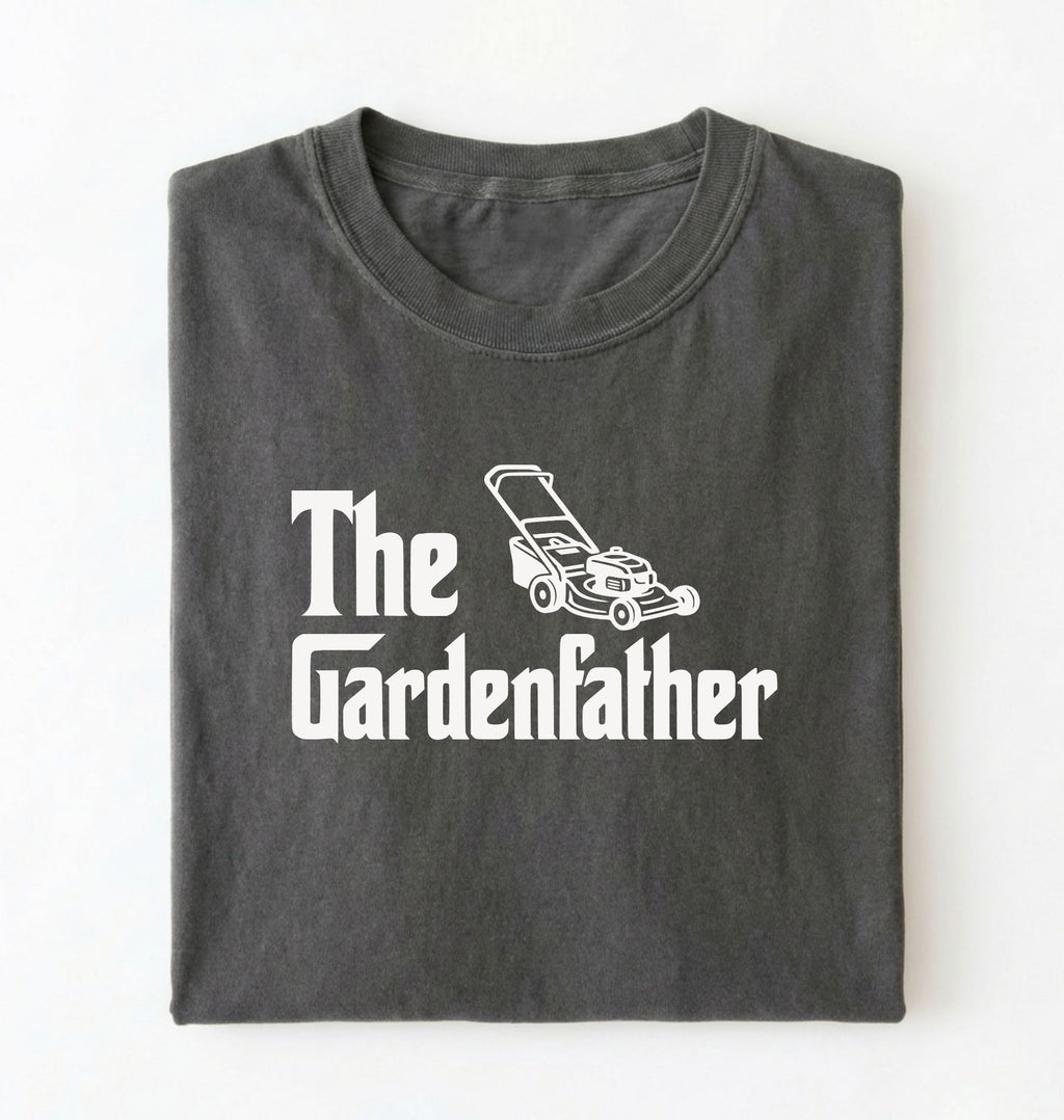 Flat lay of a the gardenfather shirt white funny gardening dad t shirt plant lover gift on a pepper background 
