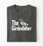 Flat lay of a the gardenfather shirt white funny gardening dad t shirt plant lover gift on a pepper background 