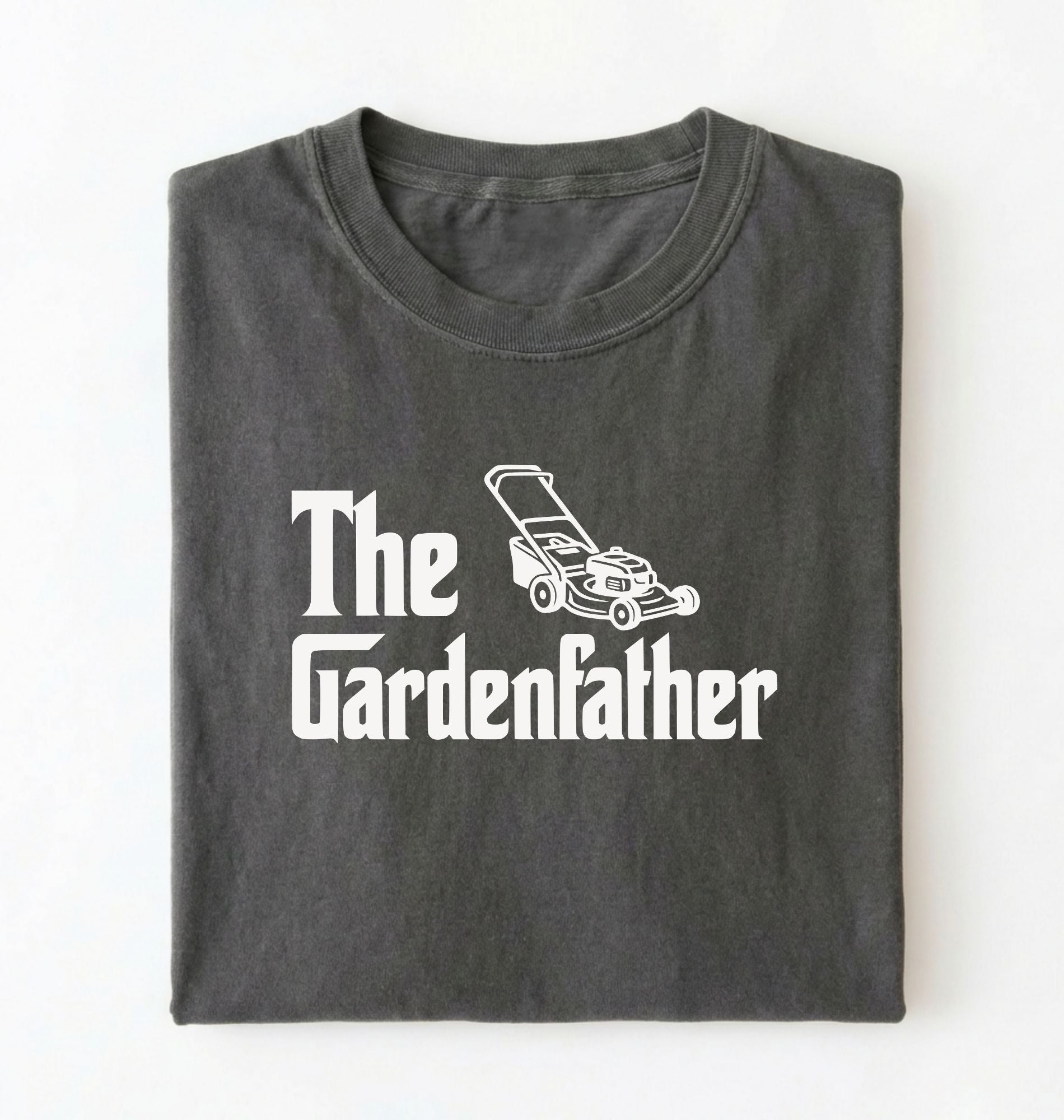 Flat lay of a the gardenfather shirt white funny gardening dad t shirt plant lover gift on a pepper background 