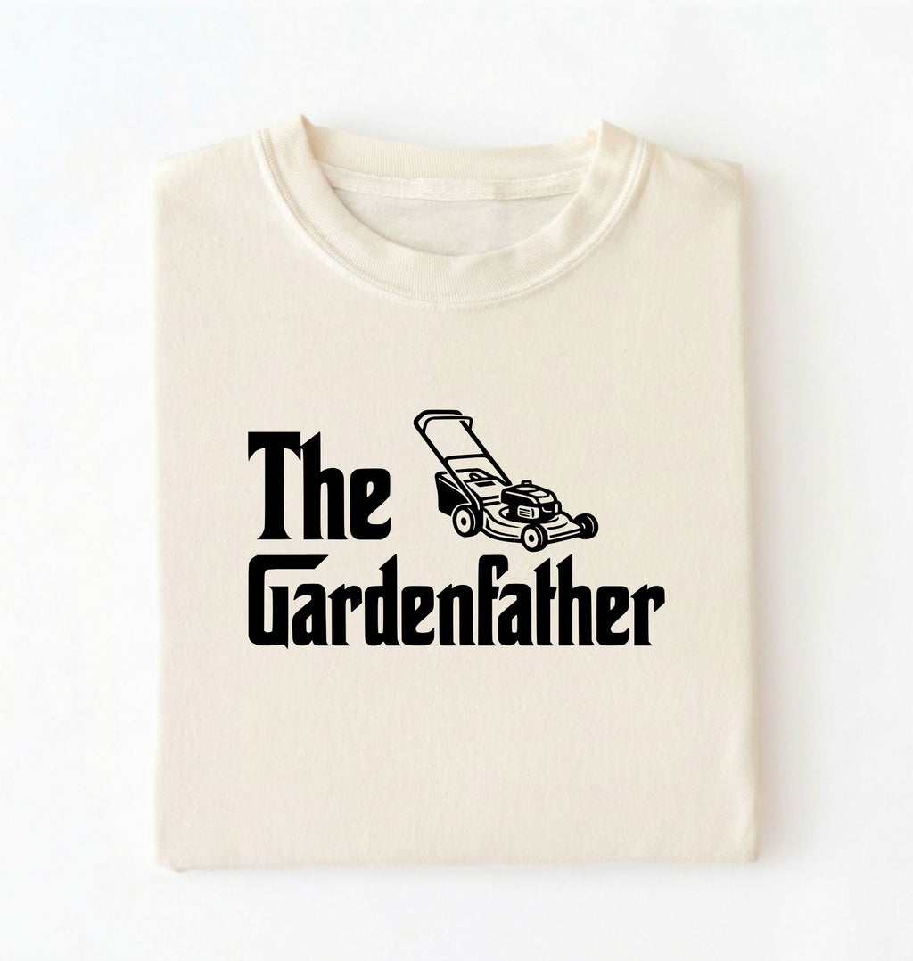 Flat lay of a the gardenfather shirt ivory funny gardening dad t shirt plant lover gift on a white background 