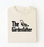 Flat lay of a the gardenfather shirt ivory funny gardening dad t shirt plant lover gift on a white background 