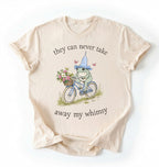 Flat lay of an ivory Cute whimsical frog shirt for nature and cottagecore fashion lovers on a white background 