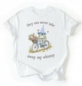 Flat lay of a white Cute whimsical frog shirt for nature and cottagecore fashion lovers on a white background 