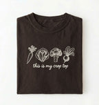 Flat lay of a dark chocolate this is my crop top shirt brown funny gardening t shirt vegetable lover cottagecore gift on a white background 