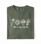 Flat lay of a green  this is my crop top shirt brown funny gardening t shirt vegetable lover cottagecore gift on a white background 