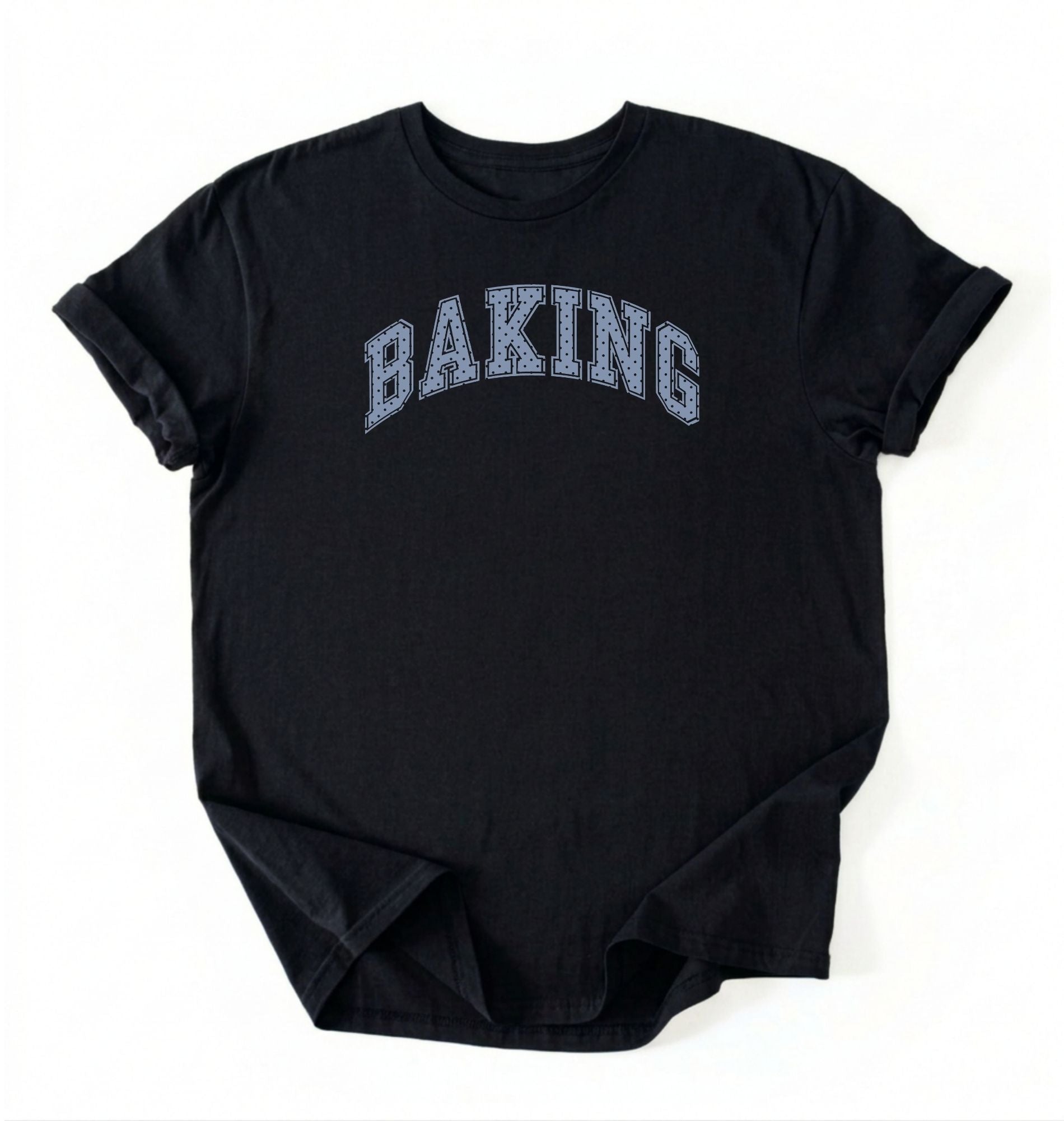 A black short-sleeve t-shirt with the word 'BAKING' printed in an arched, collegiate-style font across the chest. The letters are filled with a light blue and white textured pattern resembling a checkerboard or grid.