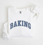 A white long-sleeve sweatshirt with 'BAKING' printed in navy blue varsity-style block letters across the chest, laid flat on a white background.