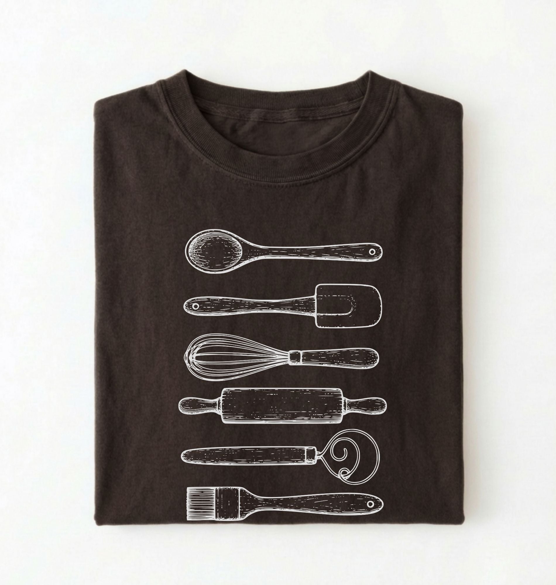 Flat ay of a Vintage baking tools shirt with whisk rolling pin and spatula illustrations on brown tee on a white background 