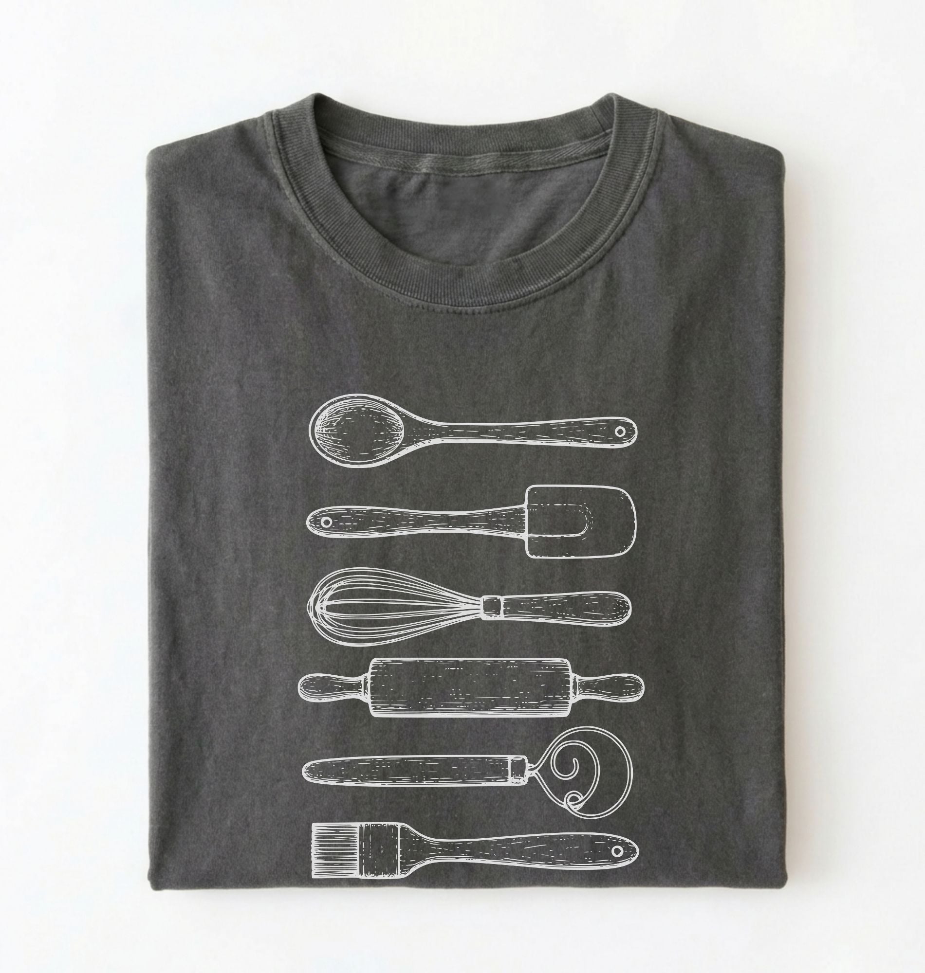 Flat ay of a Vintage baking tools shirt with whisk rolling pin and spatula illustrations on pepper tee on a white background 