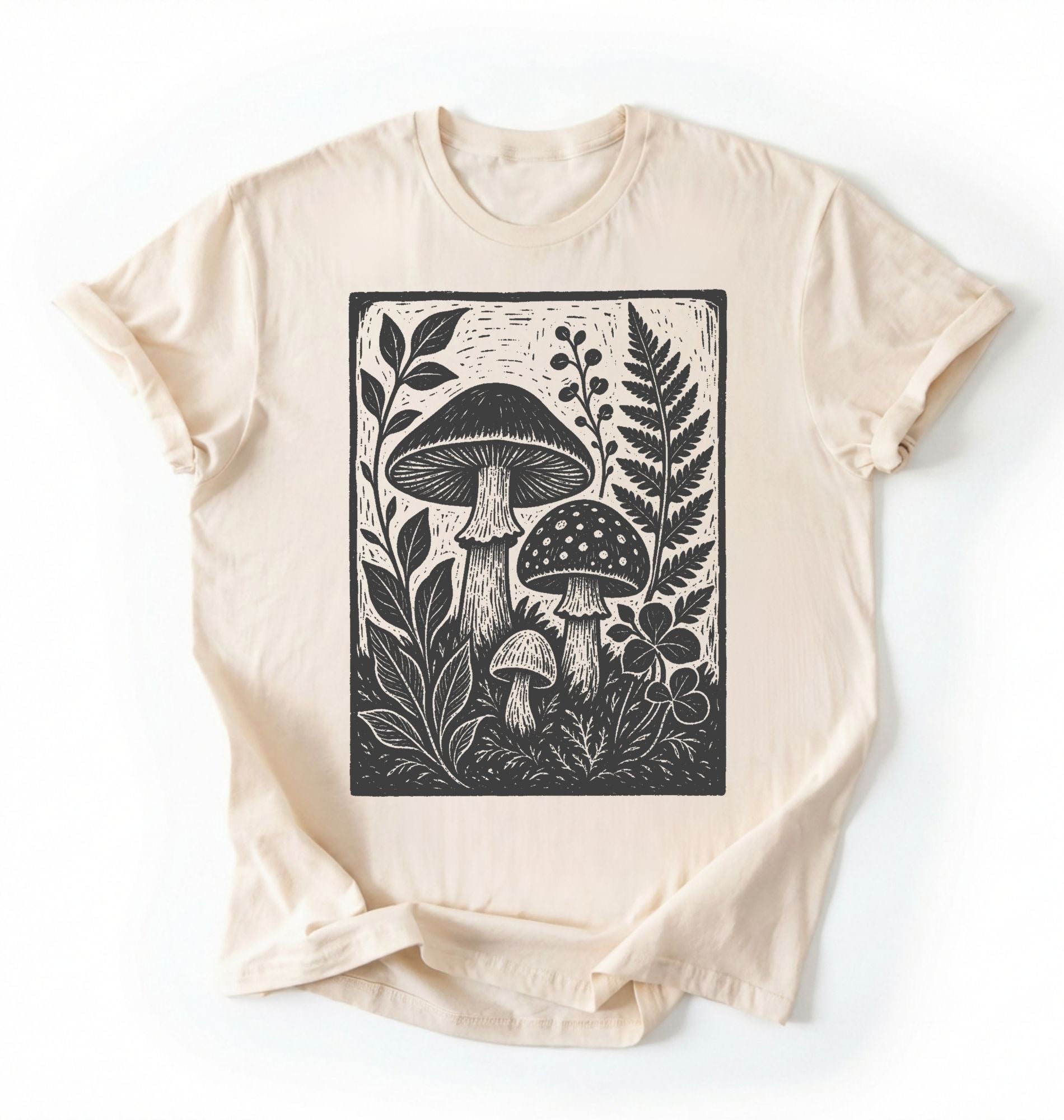 Flat lay of an ivory vintage mushroom shirt green botanical fungi t shirt nature lover gift forest aesthetic design on a white background 