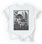 Flat lay of a white vintage mushroom shirt green botanical fungi t shirt nature lover gift forest aesthetic design on a white background 