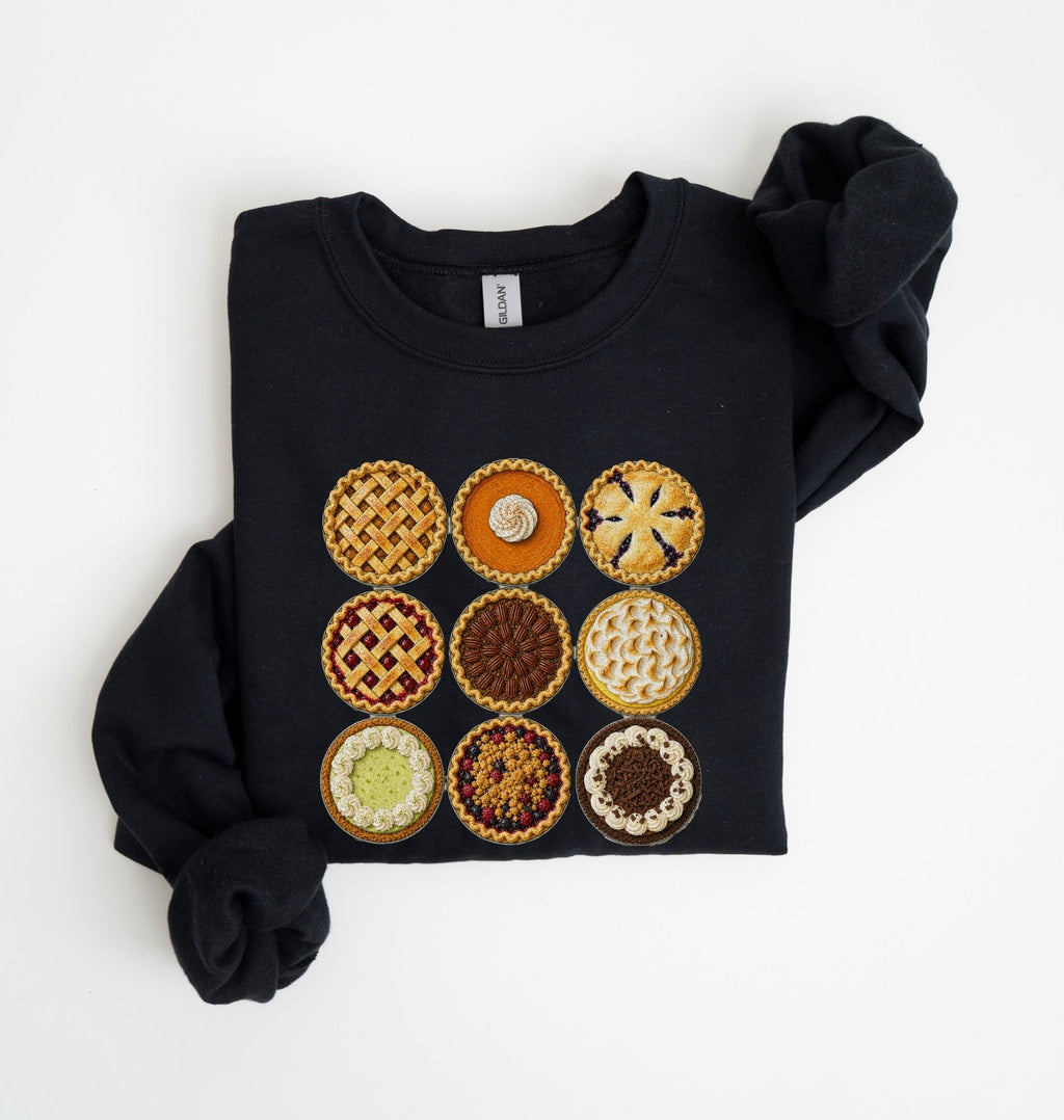 A black long-sleeve sweatshirt with a graphic print of nine different fruit and pastry pies arranged in a 3x3 grid, shown on a plain white background.