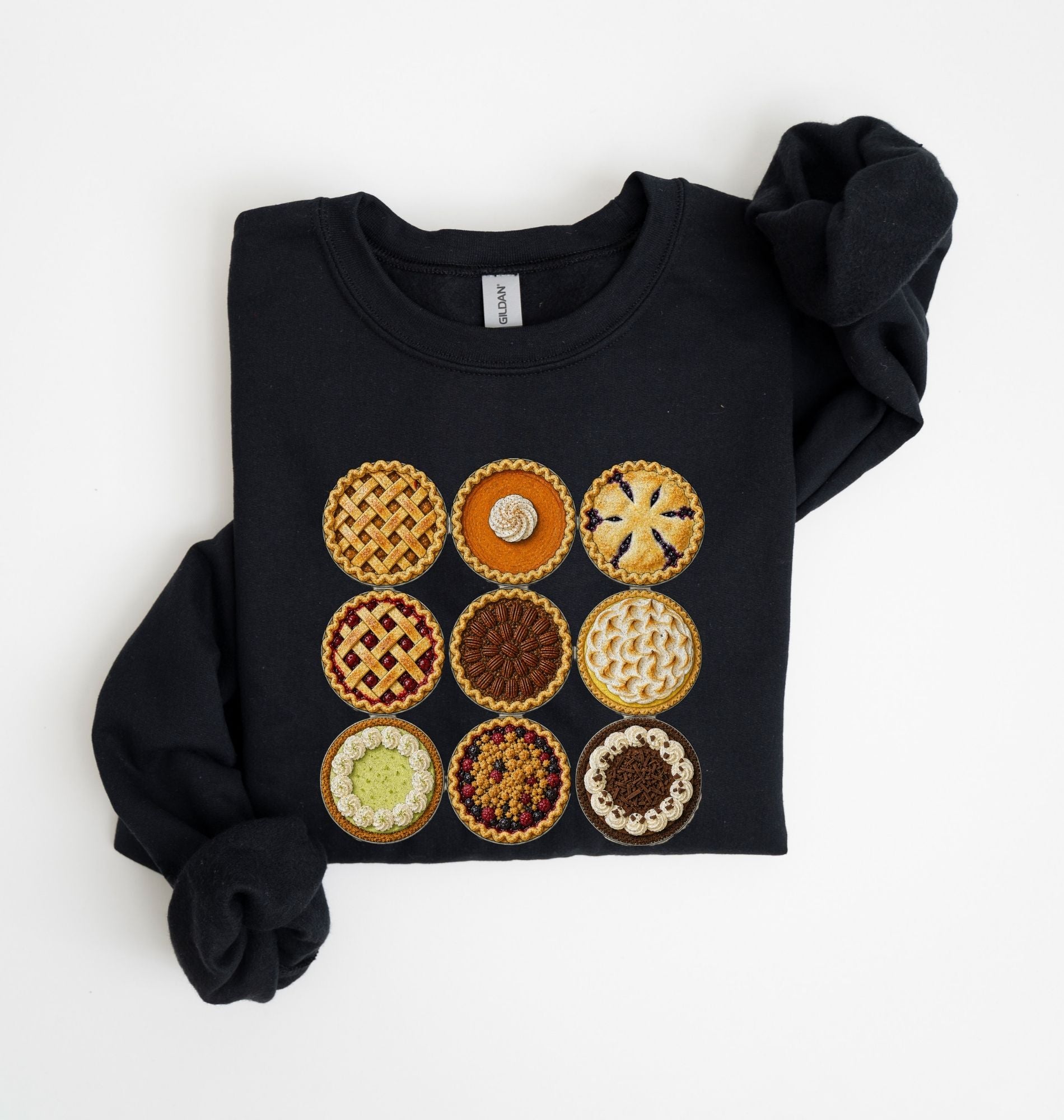 A black long-sleeve sweatshirt with a graphic print of nine different fruit and pastry pies arranged in a 3x3 grid, shown on a plain white background.