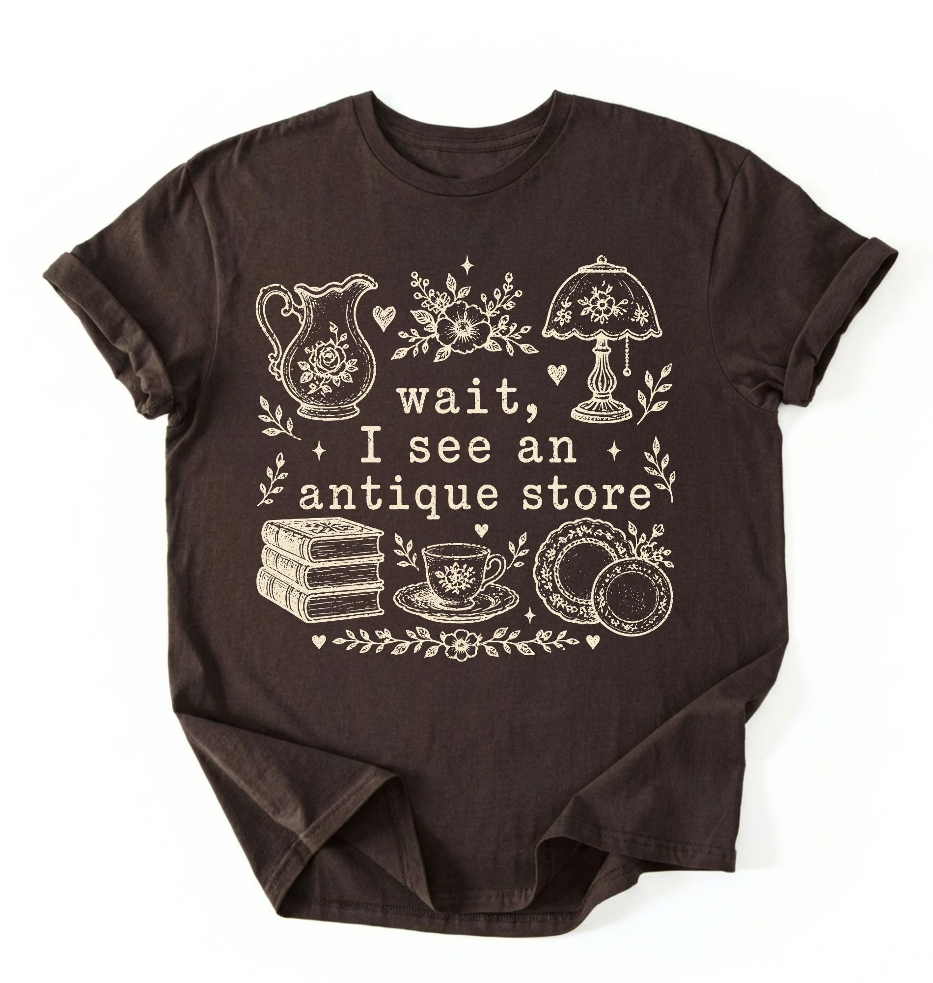 Flat lay of a brown wait i see an antique store shirt funny vintage thrift aesthetic gift on a white background 