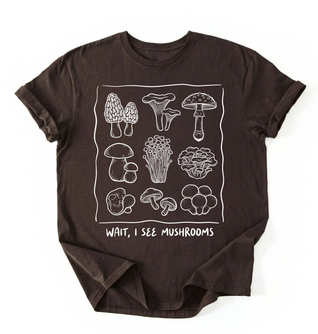 Flat lay of a Brown t-shirt with white mushroom illustrations and text on a white background on a white background 