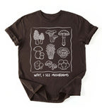 Flat lay of a Brown t-shirt with white mushroom illustrations and text on a white background on a white background 