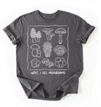 Flat lay of a Gray t-shirt with white mushroom illustrations and text on a white background