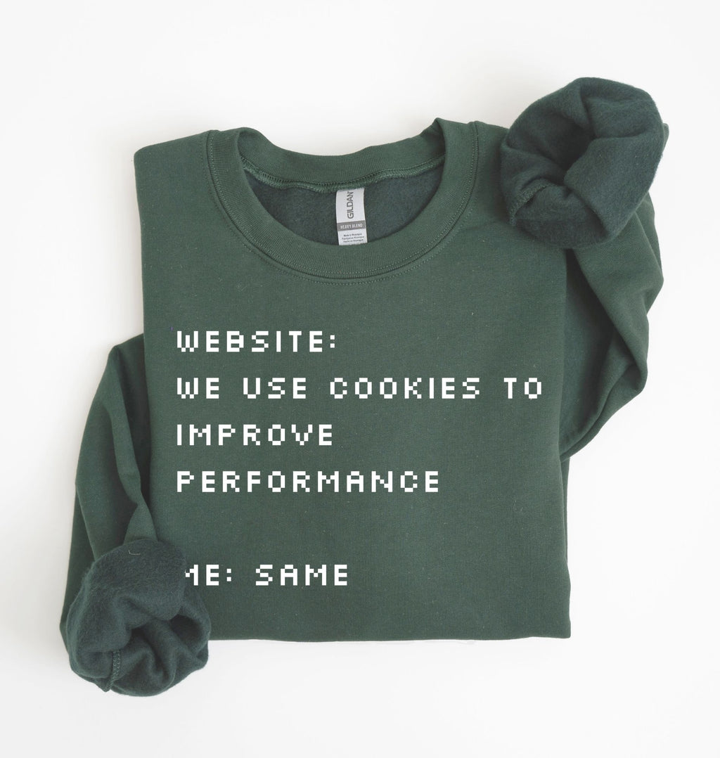 Forest Green Black sweatshirt featuring the phrase Website We Use Cookies to Improve Performance Me Same in a white retro computer font
