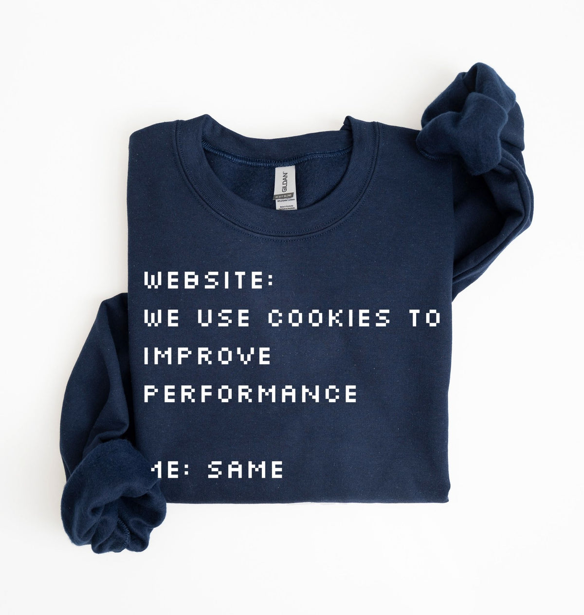 A navy blue crewneck sweatshirt with white pixelated text reading 'WEBSITE: WE USE COOKIES TO IMPROVE PERFORMANCE 4E: SAME', folded neatly on a white background.