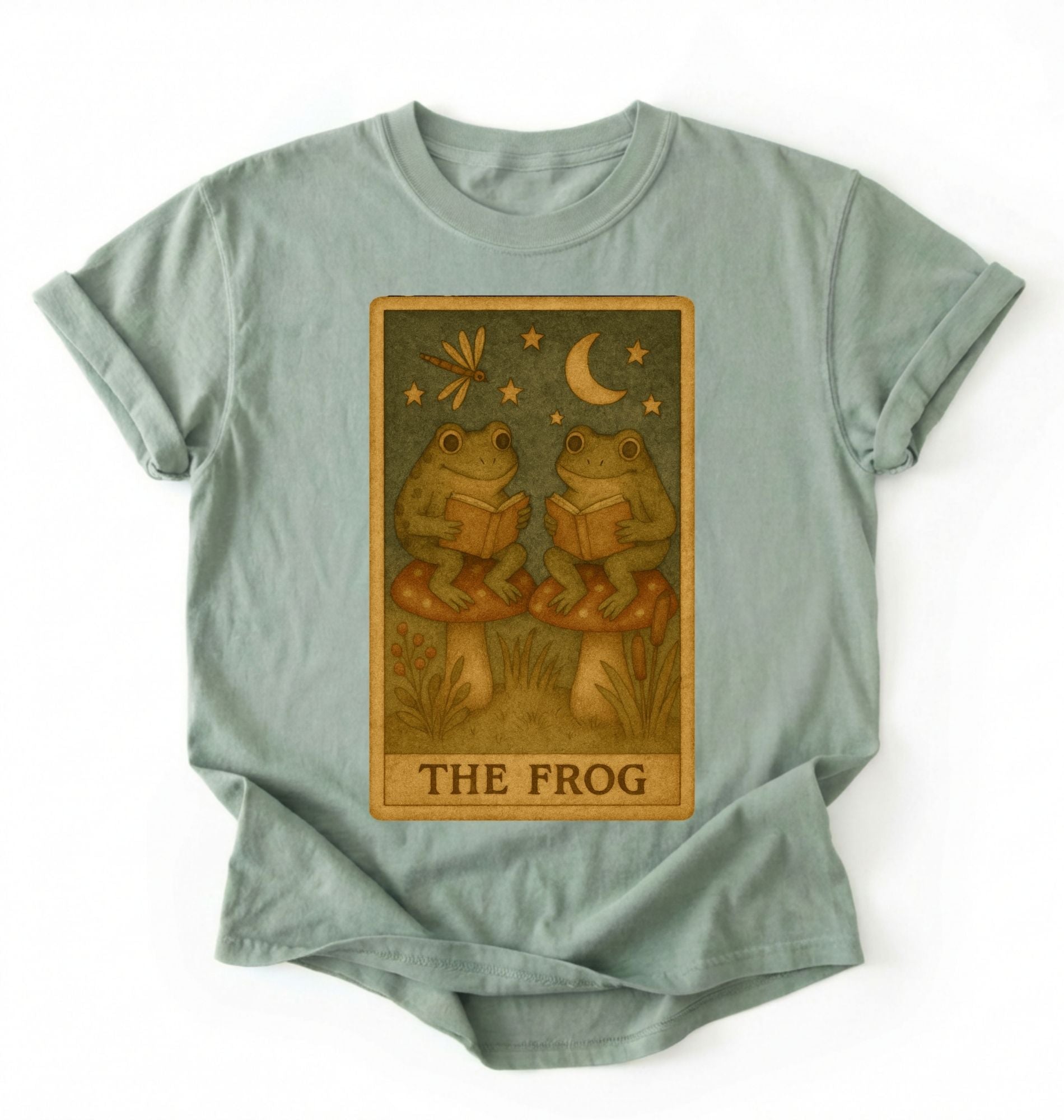 Flat lay of a bay cozy frog reading shirt perfect for book lovers and nature fans on a white background