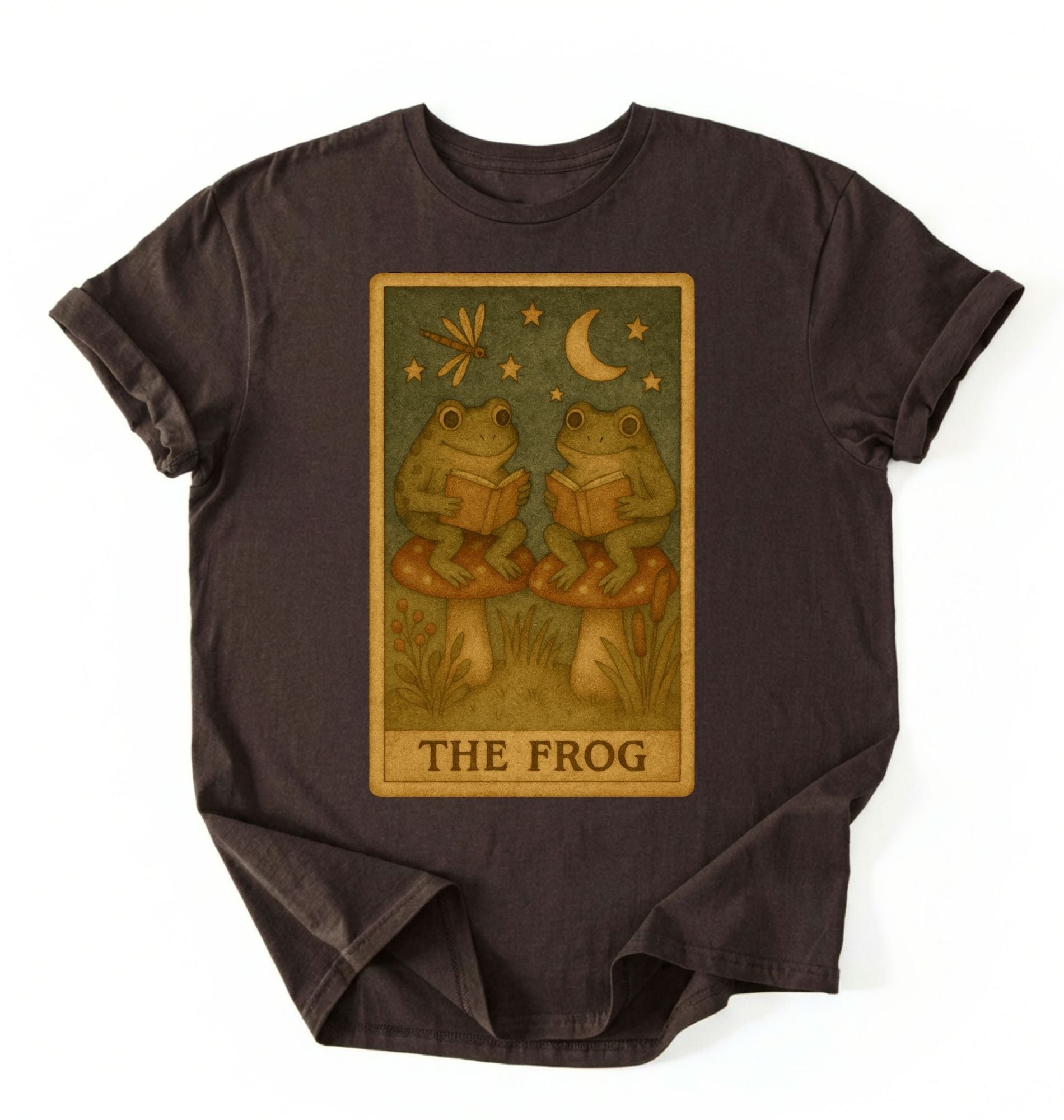 flat lay of a dark chocolate cozy frog reading shirt perfect for book lovers and nature fans on a white background 