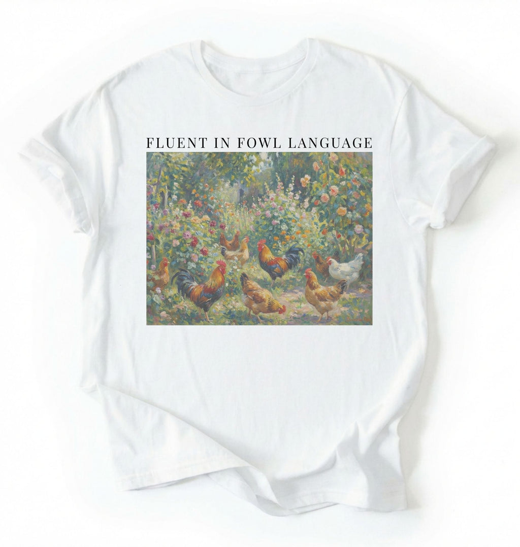 Flat lay of a White Funny Fluent in Fowl Language shirt for chicken lovers and farm animal fans on a white background
