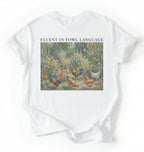 Flat lay of a White Funny Fluent in Fowl Language shirt for chicken lovers and farm animal fans on a white background