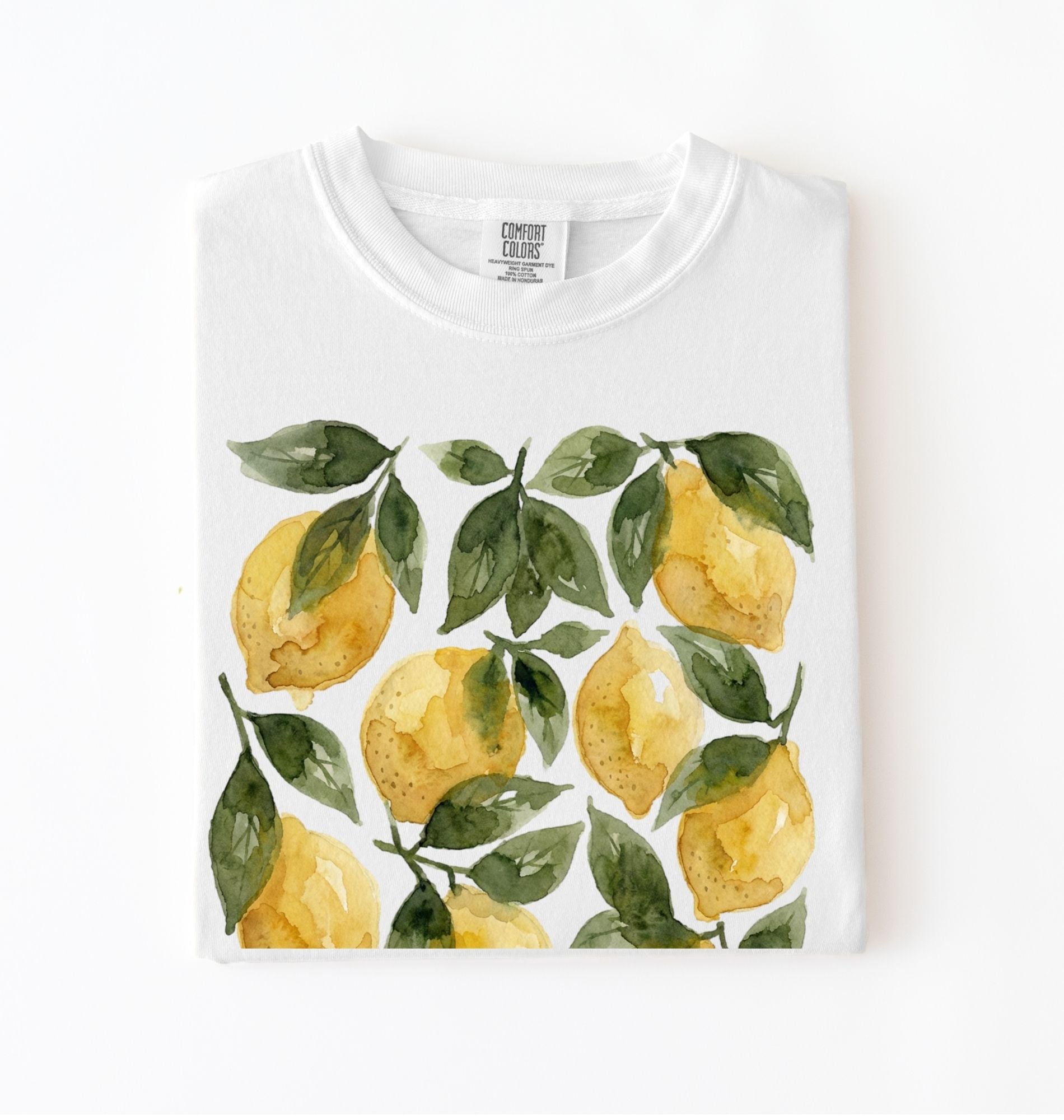 White t-shirt with watercolor lemon and green leaf pattern, cottagecore style gardener gift tee