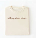 Flat lay of a ivory cozy crewneck t-shirt on a white background with text reading “Will yap about plants centered on the front 