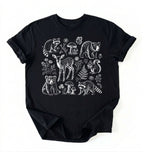 Flat lay of a woodland animals shirt black cottagecore forest animal t shirt mushroom nature gift on a white background 