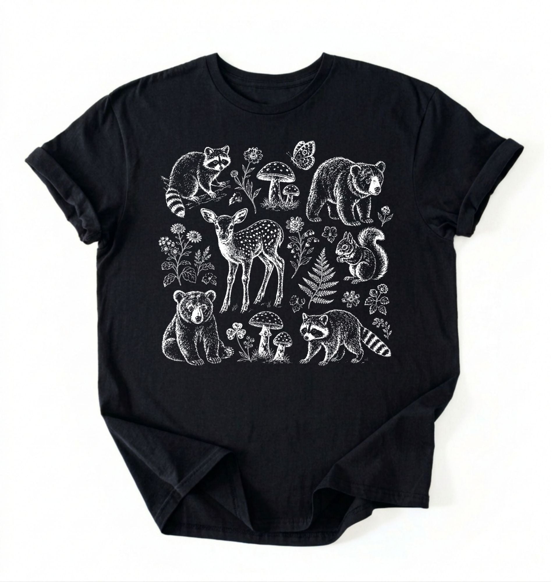 Flat lay of a woodland animals shirt black cottagecore forest animal t shirt mushroom nature gift on a white background 